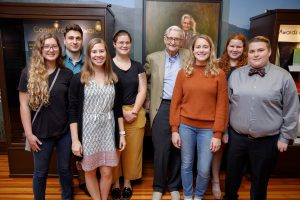 Dr. Edward O. Wilson poses for a picture in 2019 with University of Alabama students who designed an exhibit honoring his achievements. Matthew Wood, Strategic Communications, The University of Alabama